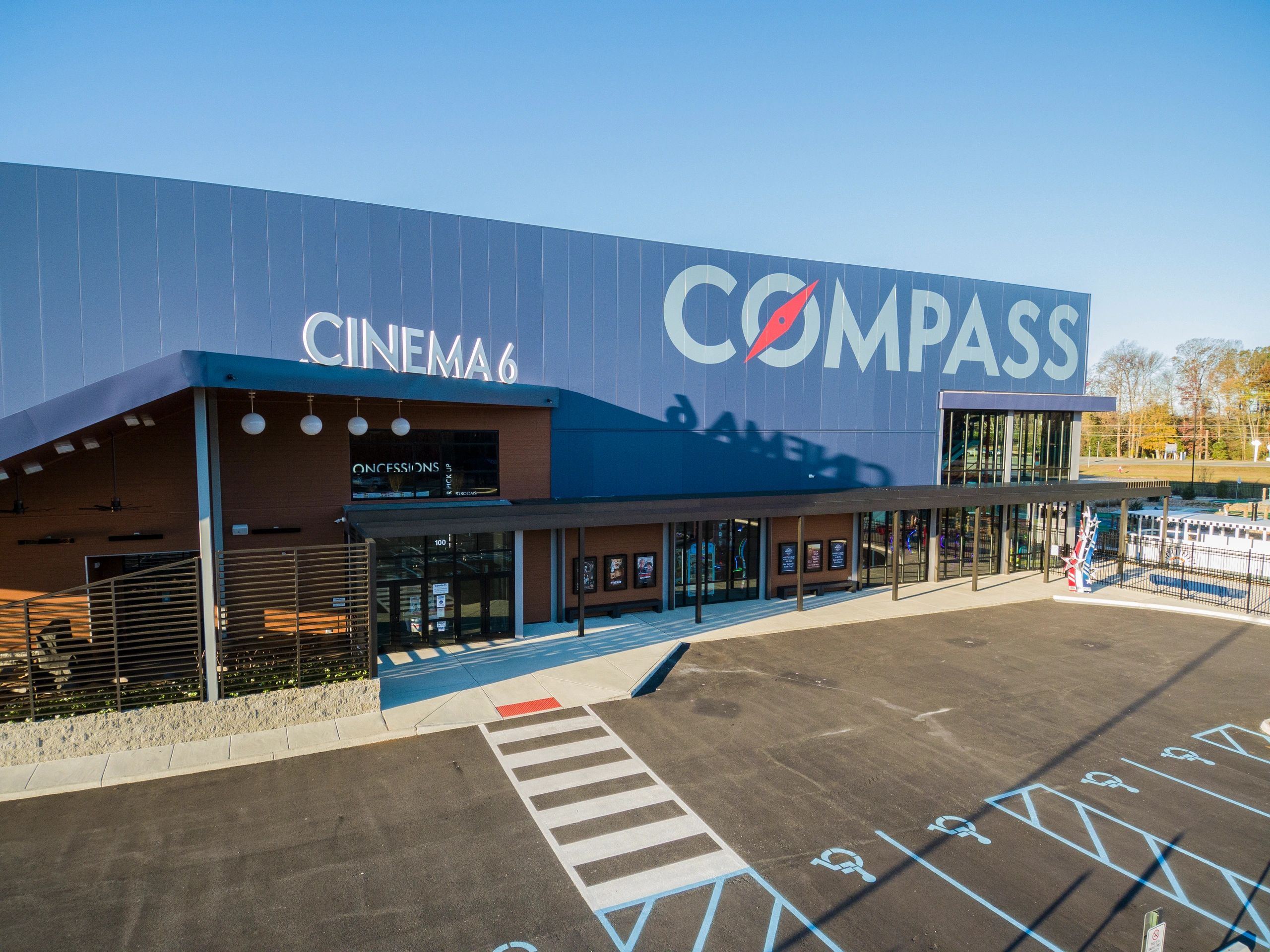 Modern cinema building with blue corrugated metal facade